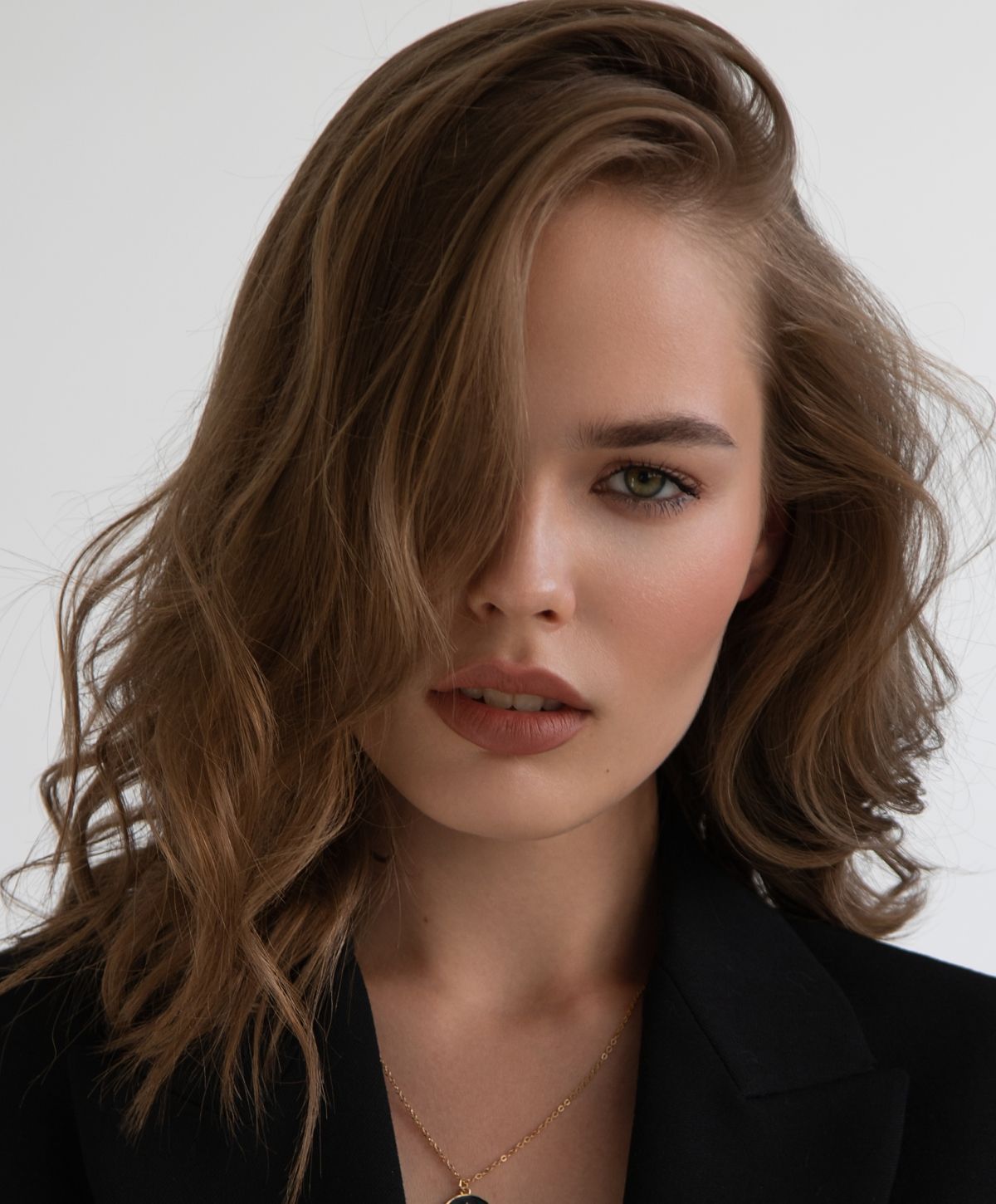 Portrait of a woman with wavy hair.