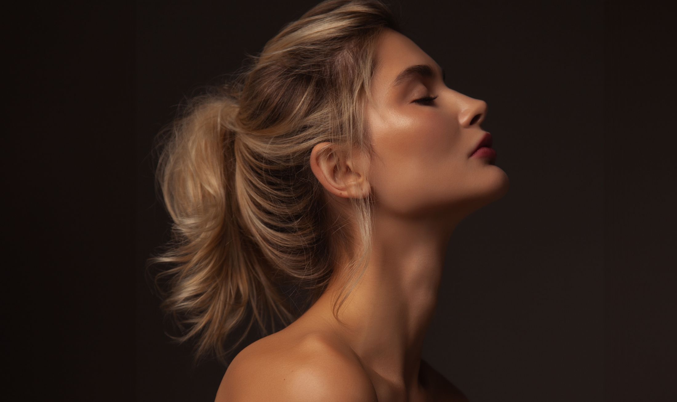 Profile of a woman with elegant hairstyle.